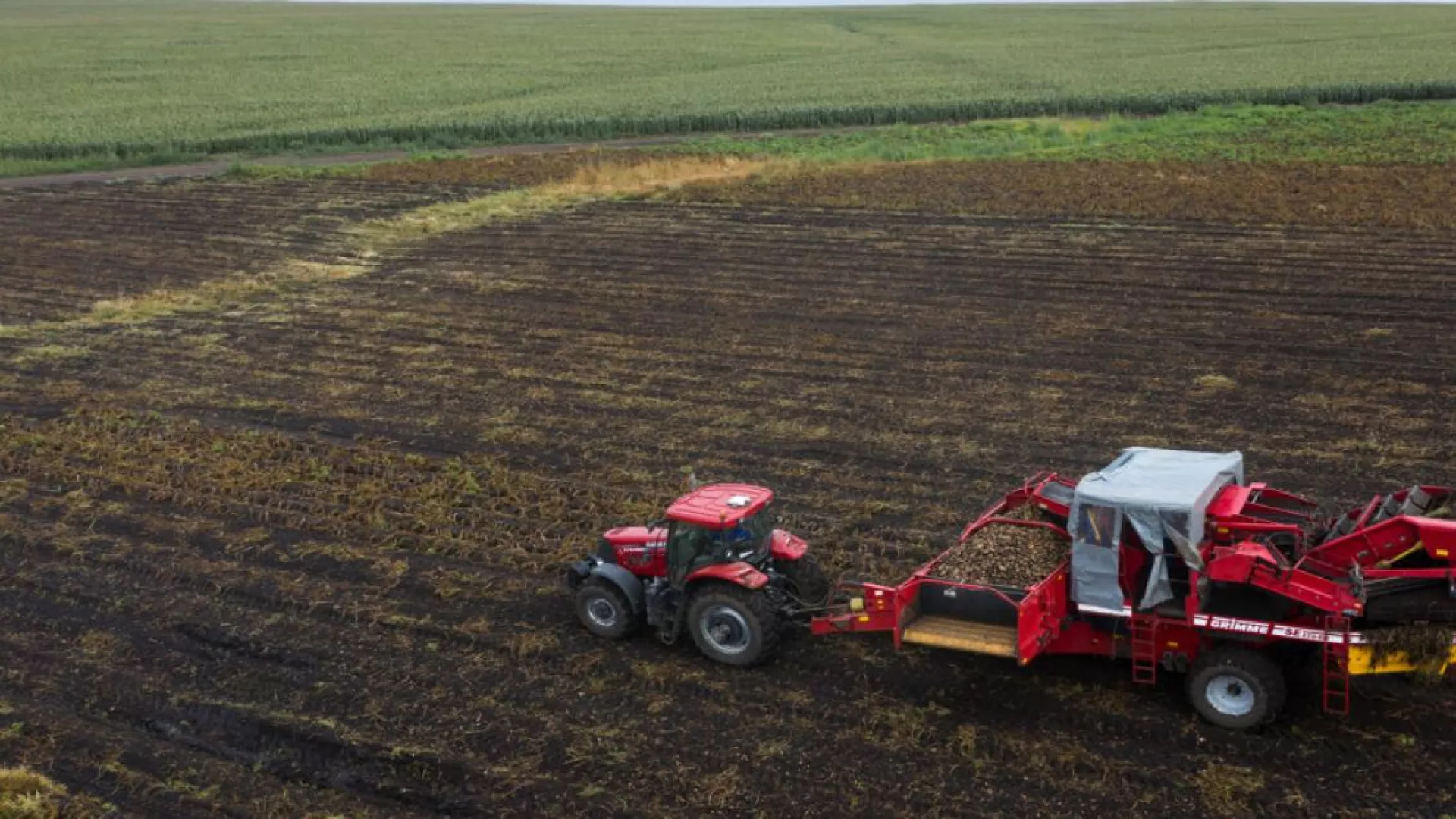 Interra Scan red tracktor driving over potato field 