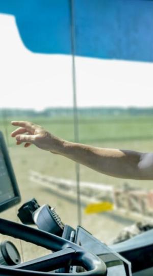 Interrascan case study man driving tracktor 