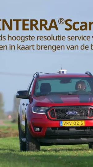 red truck interrascan in field 
